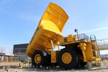 The dump truck stands over seven meters tall