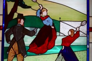 Stained glass showing lawn tennis on the Bluff
