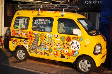 The yellow van parked outside Cafe Konichiwa