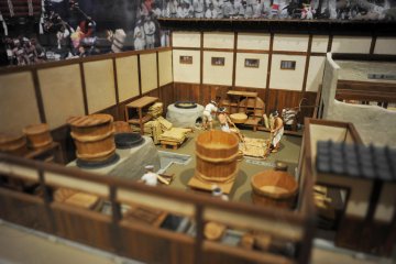 A diorama of the soy sauce making process