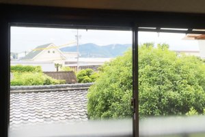 The guesthouse has a view of the distant mountains