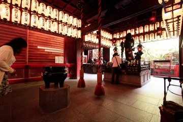 Woman walking in rounds repeatedly as part of her praying ritual inside Ichigandou Hall