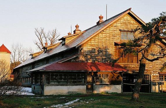 Rustic farm houses litter the landscape.