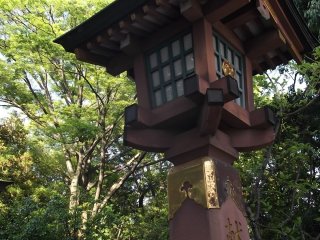 A wooden lantern by the steps up to the halls