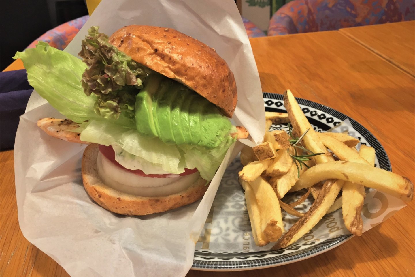 Salmon, avocado, tomato, onion, lettuce, and a house tartar sauce. The perfect salmon burger. No contest.