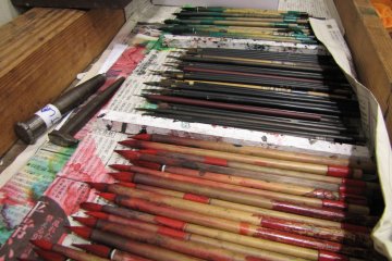 A selection of paintbrushes used to create the dolls