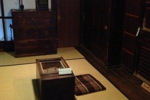 Edo period dressers and a "space heater" in a room next to the kitchen.
