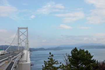 A bridge stretches over the narrowest part of the Naruto Strait. The whirlpools lie underneath.