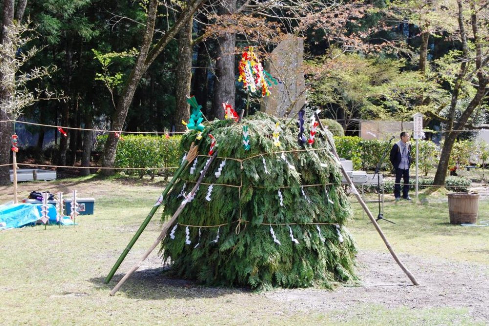 The assembled bonfire is set in the middle of a roped-off square