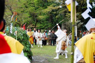 All actions and implements of a fire ceremony have symbolic meaning. Here is a yamabushi shooting off arrows in 6 directions to drive away evil spirits