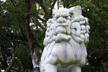 Stone lion guarding the gate