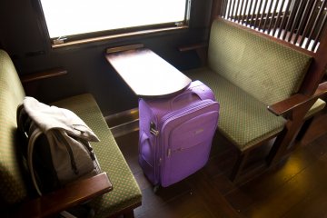 Comfortable seats and a table in the passenger carriage of Isaburo Shine