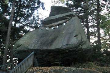Follow a path along the shrine and find a huge boulder shaped like a samurai helmet.