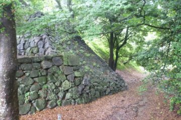 The steep walls and moats surrounding Yoshida Castle