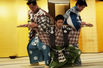 Three actors perform Kyogen