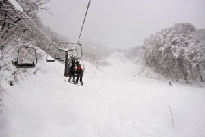 Riding the pair lift to the top
