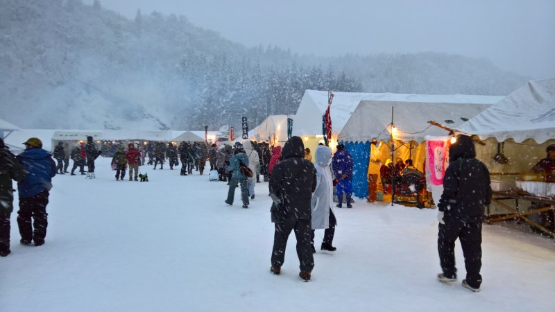 Some tents are set up to eat and stay warm before the start of the festival