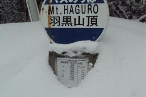 The heavy snowfall means Mt. Haguro is the only Dewa Sanzan mountain accessible during the winter. The snowfall almost buries a bus stop sign.