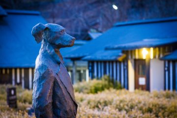 The standing dog statue of the distinctive Ramune Onsen