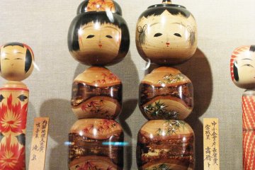 Artistic kokeshi with different designs of shape and decor
