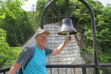 Ringing the bell at the summit of the look out