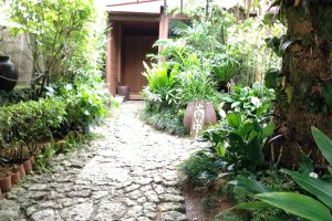 A traditional Okinawan courtyard welcomes you, preparing your mind as you enter the restaurant