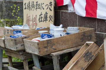 Crates full of ceramics lie on the roadside in the pottery town of Arita