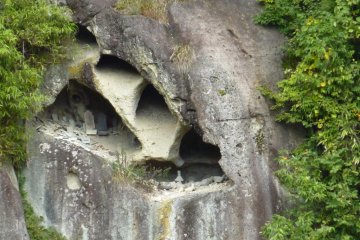 Close up photo of caves at Yamadera Temple that look to contain gravestones