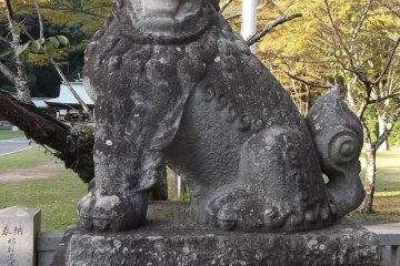 A guardian lion at the gate to the main compound
