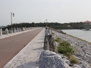 The road across Kurashiki Dam is picturesque along both sides and each end