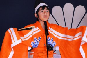 A young girl performs kowakamai