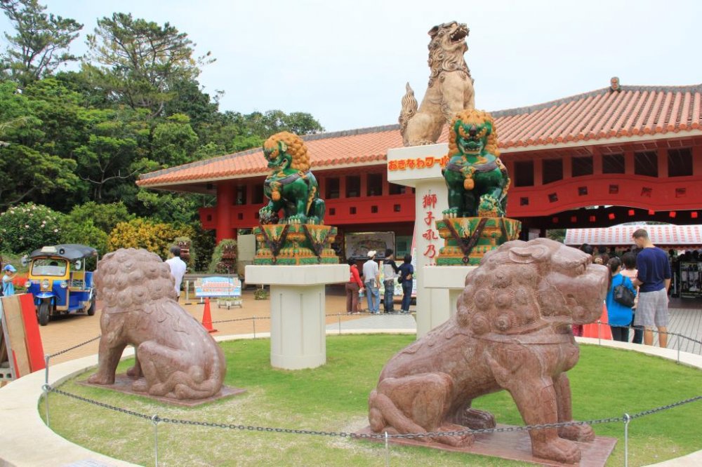 Shisa dogs at the entrance of Okinawa World demand that visitors walk around them to gain entrance to the park