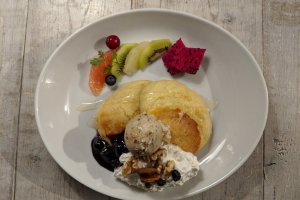 Another pancake variety served with fresh fruits and vegan ice cream