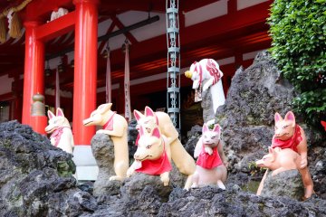 108 foxes inhabit the shrine, each having its own pose