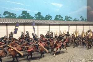 Several exhibits incoporate miniatures. The lord of the Date clan wanted his troops to stand out when marching along other samurai. The solution: golden cone hats.