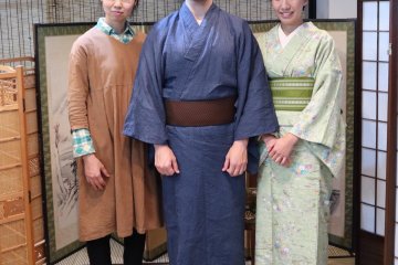 Master Seiko on the left posing with two happy customers