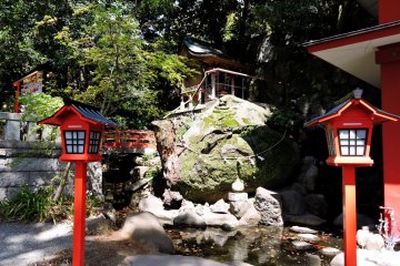 Small shrine overlooking a koi pond