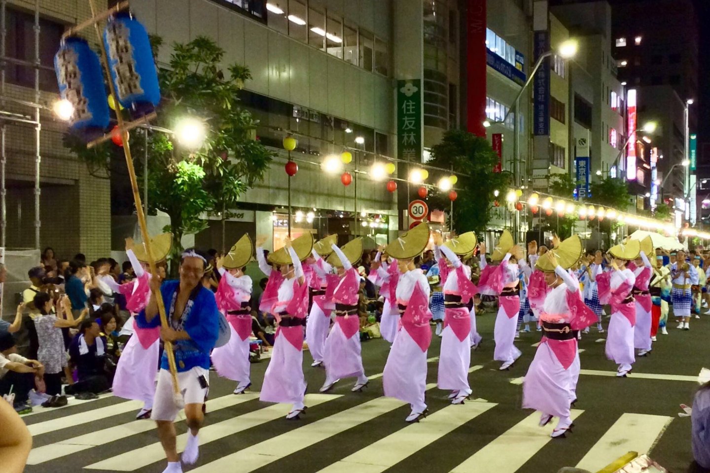 Local and Tokushima teams perform the exuberant dance moves