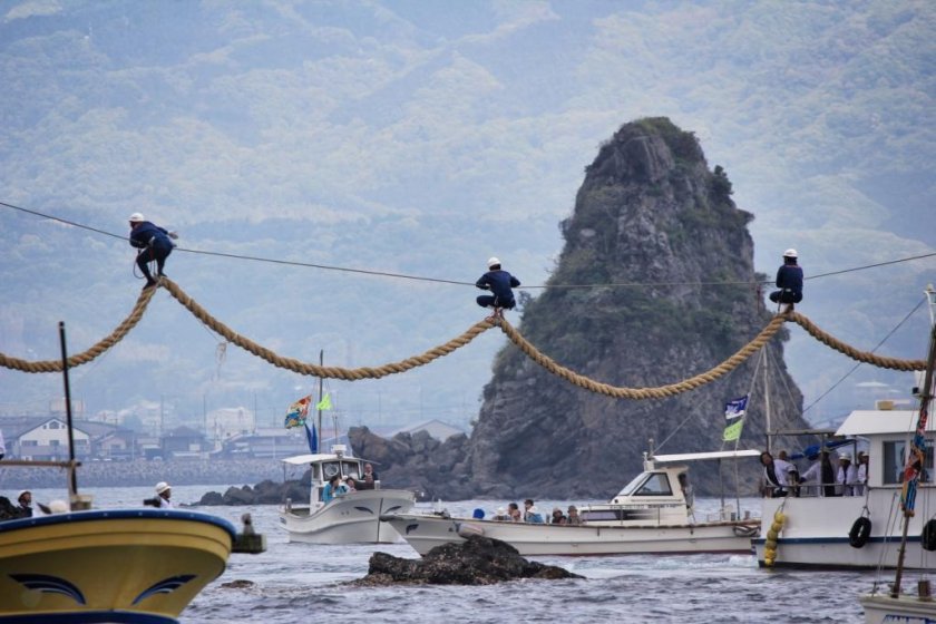 Day two of the Hojo spring festival — renewing the rope between the twin rocks