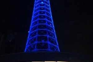 The beautiful Yokohama Marine Tower, lit up at night.