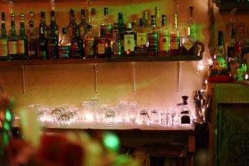 Behind the bar is a wide selection of drinks