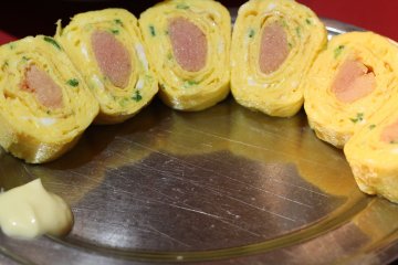 Featured here is the chef's recommendation: mentai tamago yaki (scrambled egg with spicy cod roe).