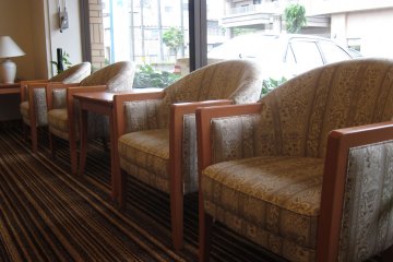 Cushioned chairs for rest in the lobby