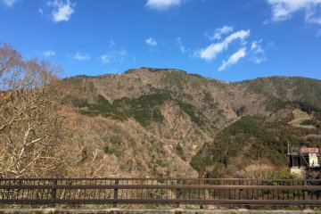 Myojogatake (elevation 924 meters) as seen from a bridge in the town