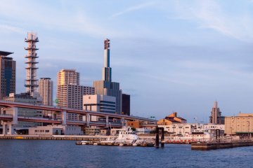 The city and port glow pleasantly as the sun sets, making this a great spot to check out the tall buildings of Kobe.