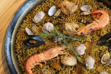 A savory paella which features seafood and meat