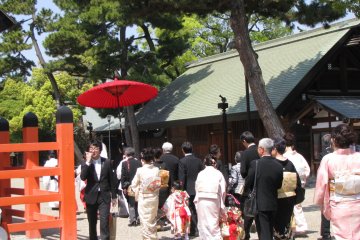 Wedding procession leaving a shrine