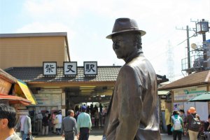 A statue of Tora-san greets visitors as they leave Shibamata Station