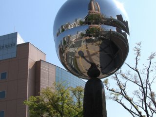 Mirror object reflecting Hamamatsu Square