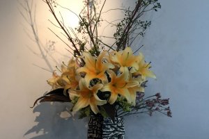 Seasonal flowers greet guests at the door